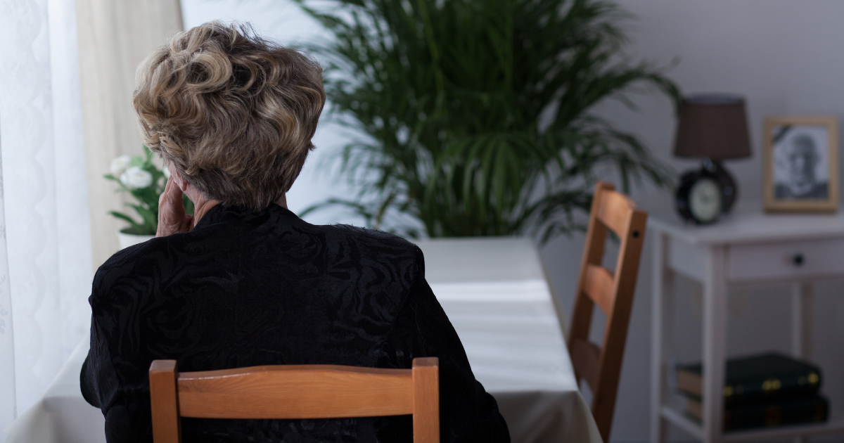 Older woman overwhelmed with loss of spouse and managing finances
